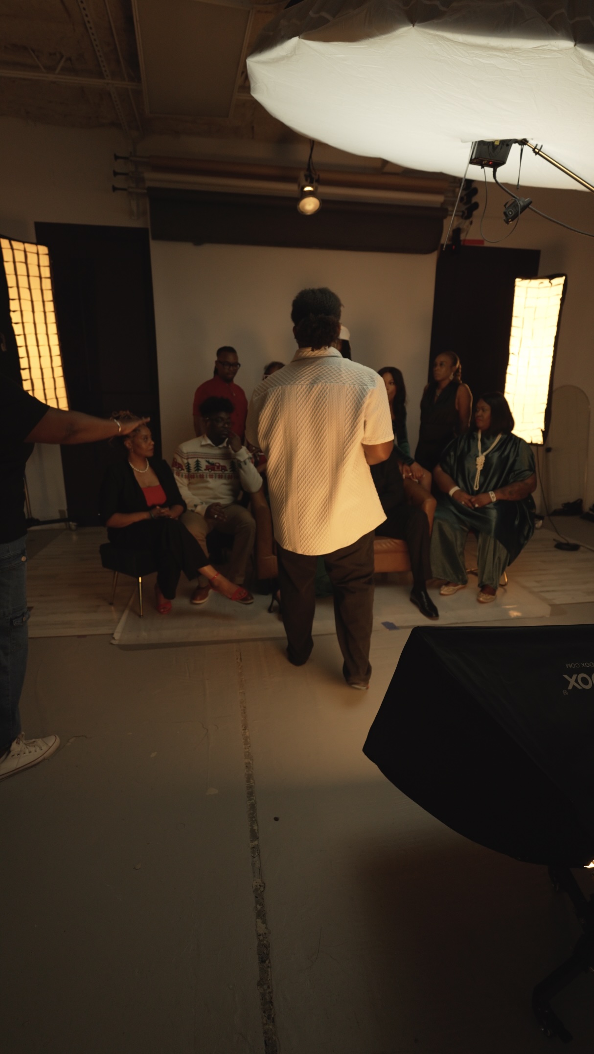 Rashad Roberson of The RCM Studios directing a lit portrait session on location in Houston